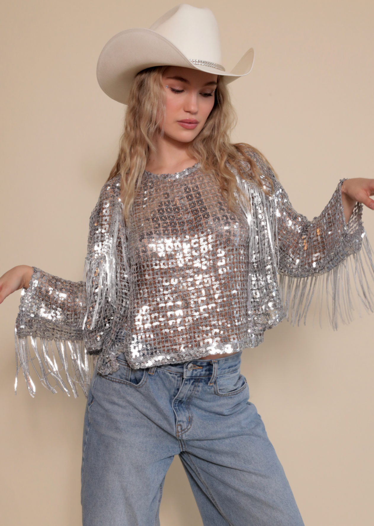 Silver basic tank with square sequin pattern and matching fringe jacket paired with white cowboy hat.