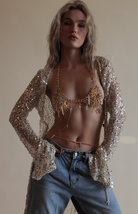 Gold Madonna Chain Bra with metal crosses paired with matching belly chain and sequin net duster.