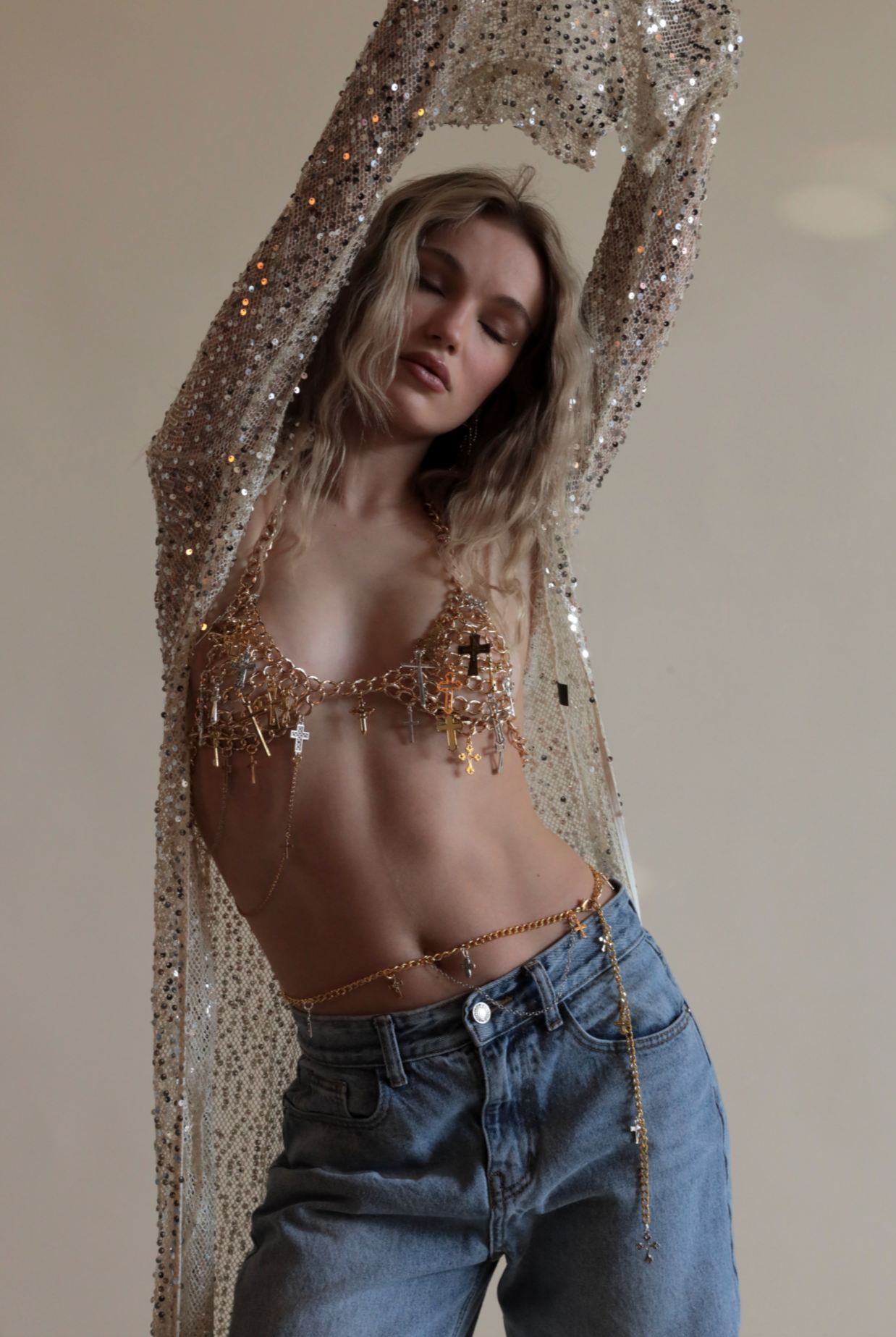 Gold Madonna Bellychain with gold and silver cross charms paired with matching chain bra and sequin net duster.