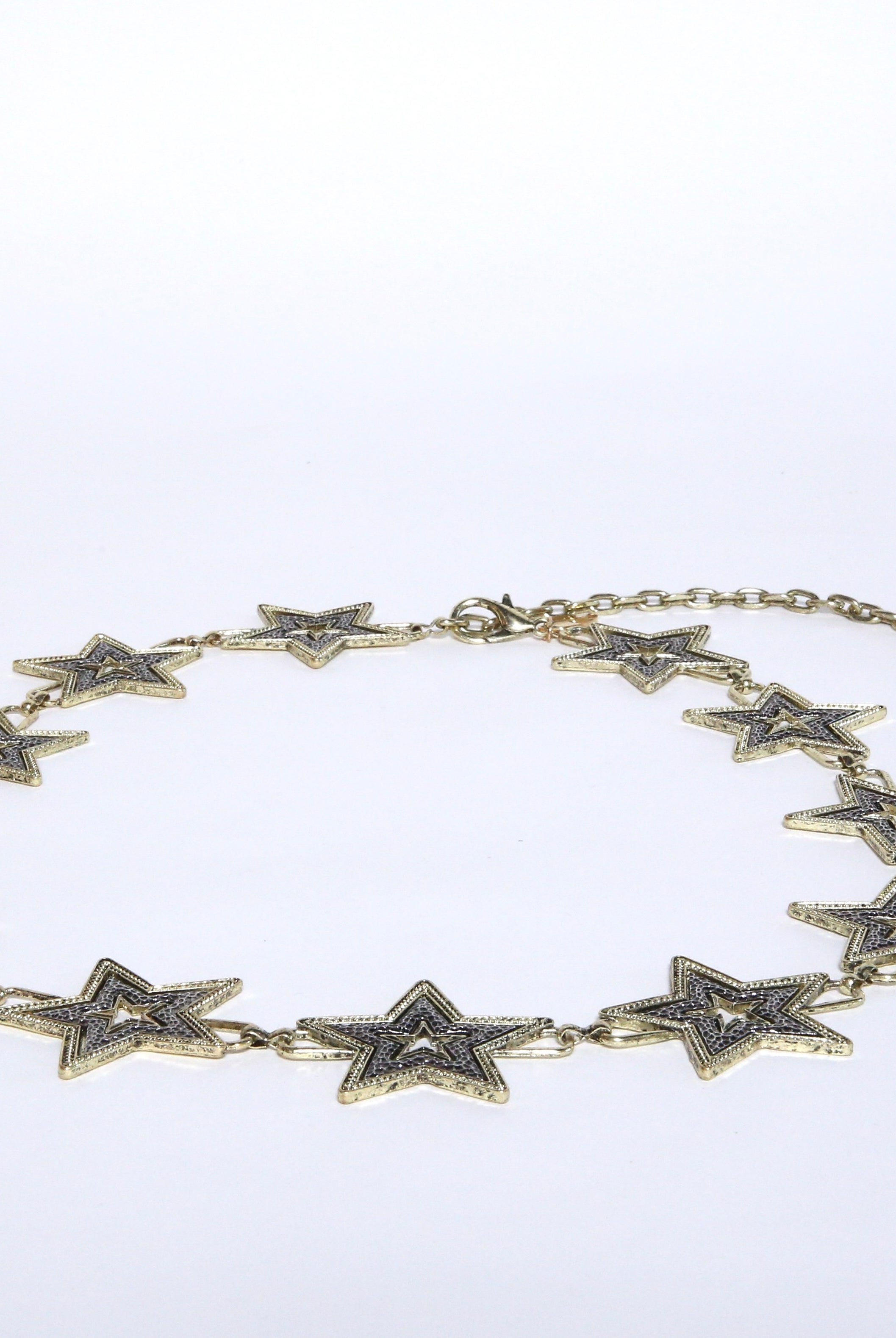 Gold and silver chain metal star belt that is one size fits all.