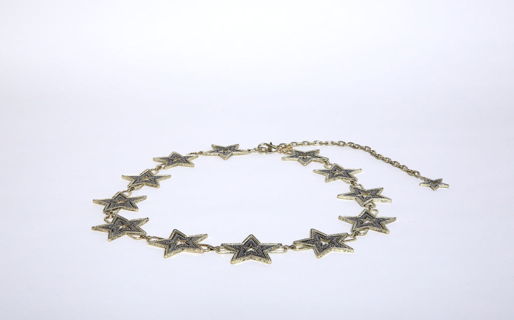 Gold and silver chain metal star belt that is one size fits all.